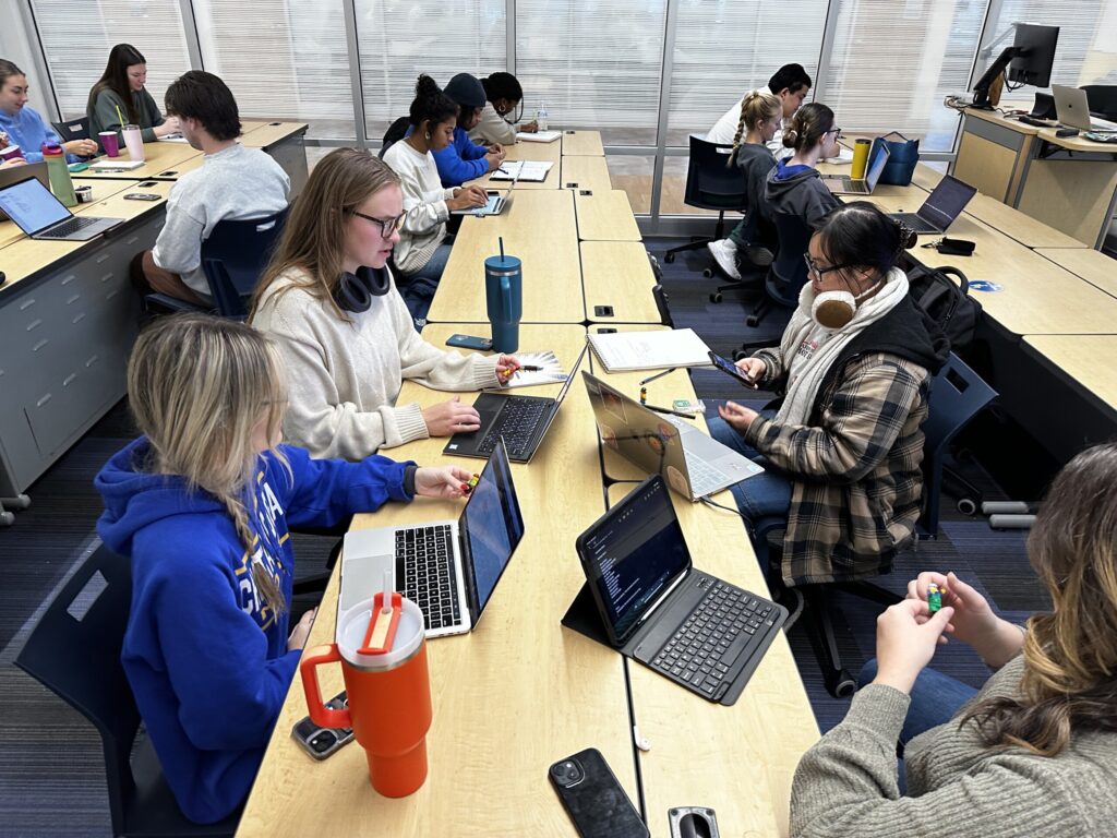 Creative teams work on their campaign proposals after client meetings.