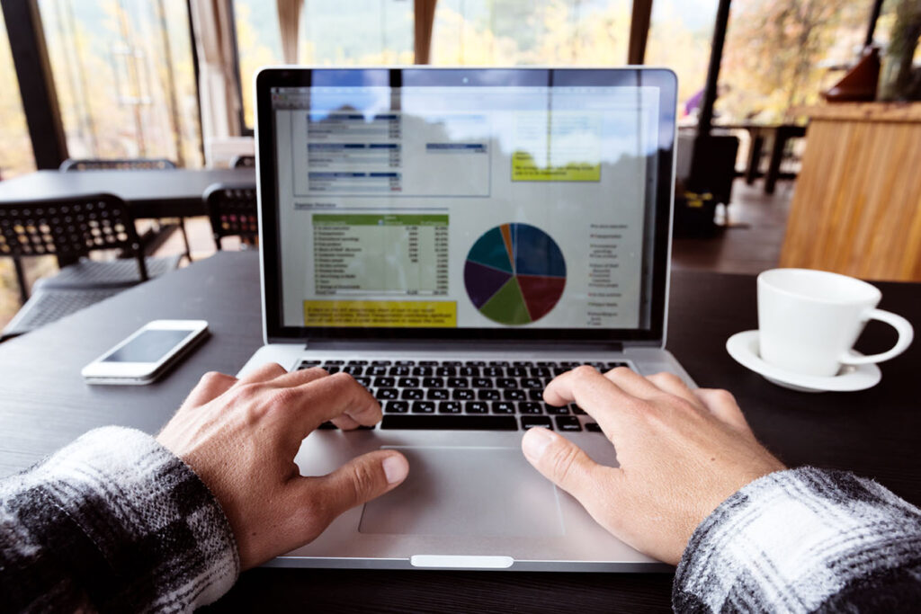 Person working on excel spreadsheet