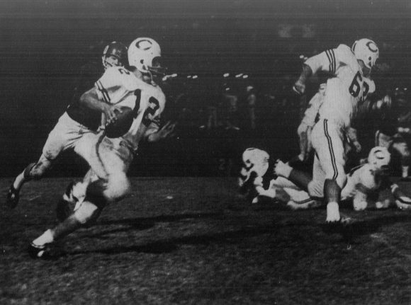 Joe Dunn gains yardage on the field