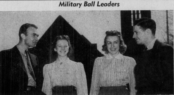 Photograph of Military Ball leaders on the campus quadrangle with Patten Chapel in the background.