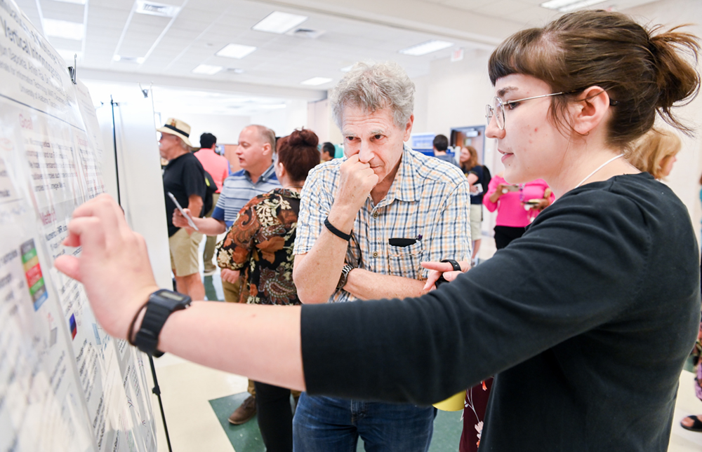 Sara Bey explaining her research at the Summer 2019 Undergraduate Research Symposium
