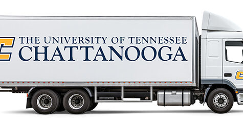 white moving truck with UTC logo on the trailer and the power c on the cab.
