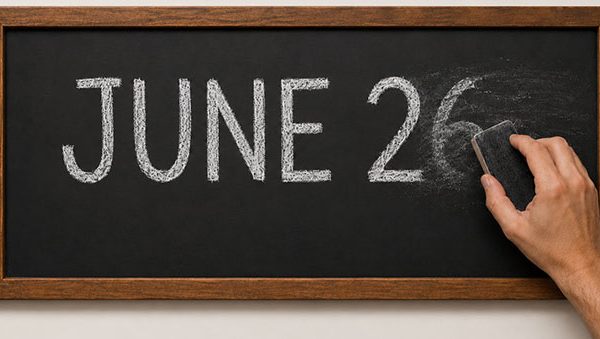 black chalkboard with June 26 being erased