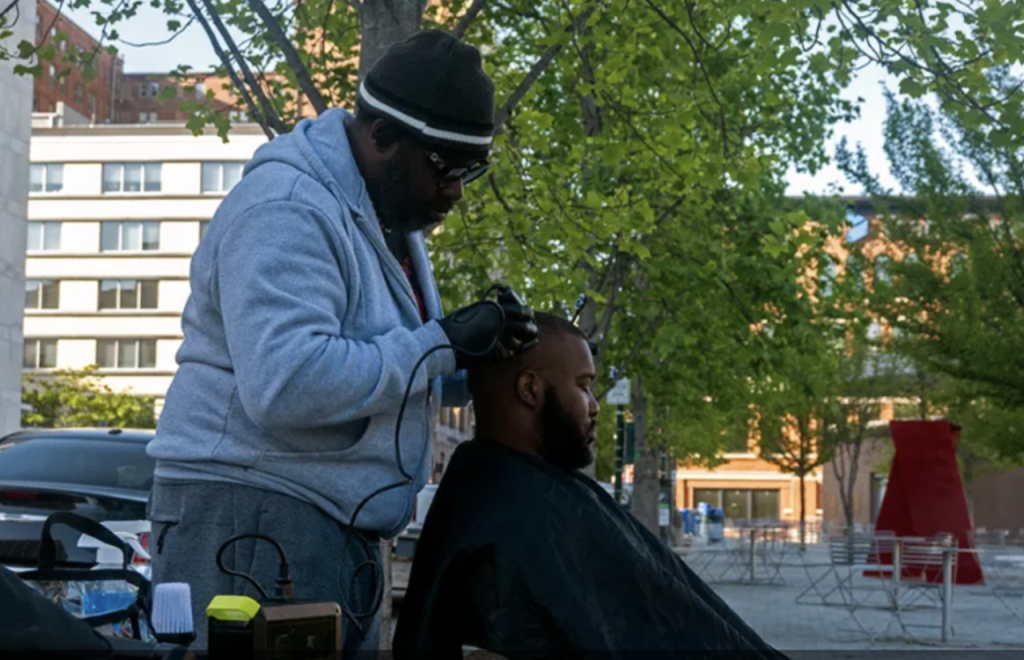 Bryan Slayton gives a haircut.