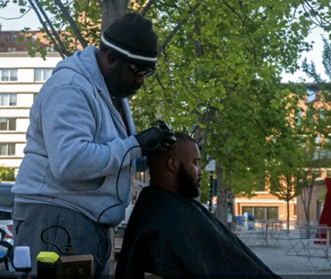 Bryan Slayton gives a haircut.