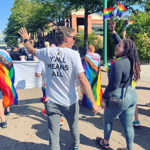 Chattanooga Mayor Tim Kelly Walking in Pride Parade in October 2025. The mayor wears a t shirt that says Y'all Means All. Photo credit: Seed Theater.