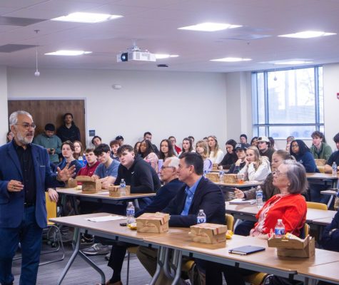 Hamid Andalib speaks to room full of people.