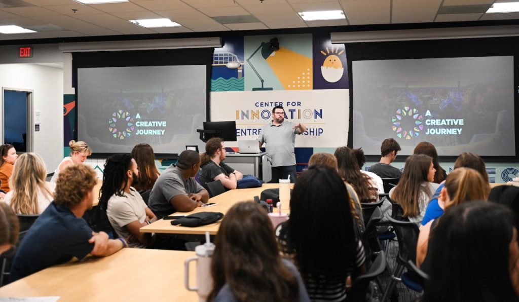 An instructor stands in front of students during a class in the Max Fuller Center for Innovation and Entrepreneurship.