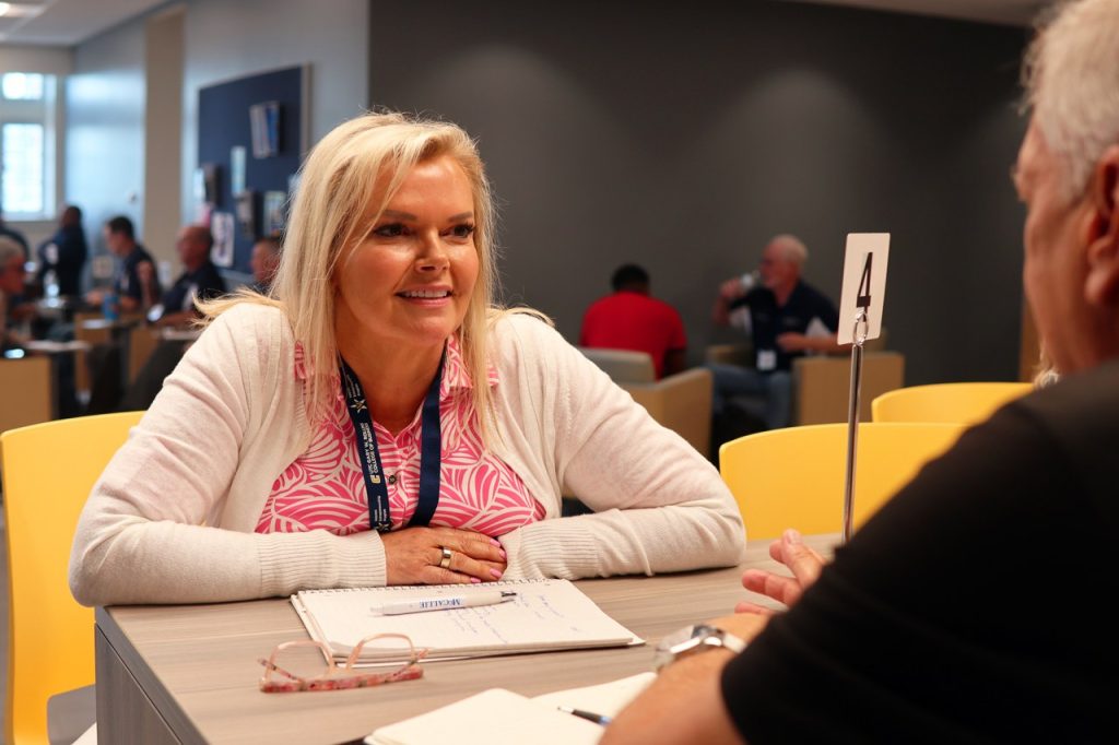 Woman talking across a table