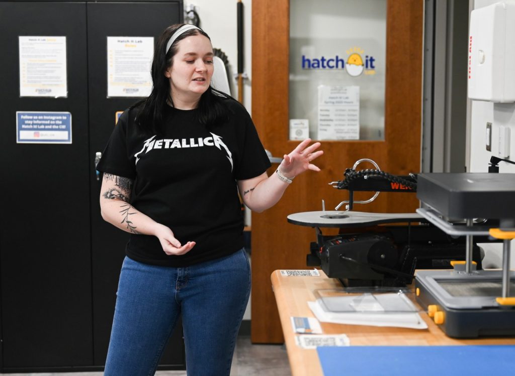 A student show off equipment in the Hatch It Lab inside the Max Fuller Center for Innovation and Entrepreneurship.