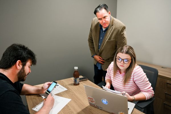 Sales Institute's Chris Plouffe mentors a students during a training session.