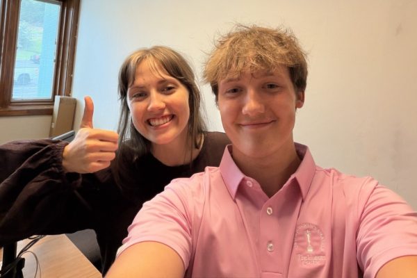 Aiden Scoggins taking a selfie with a friend.