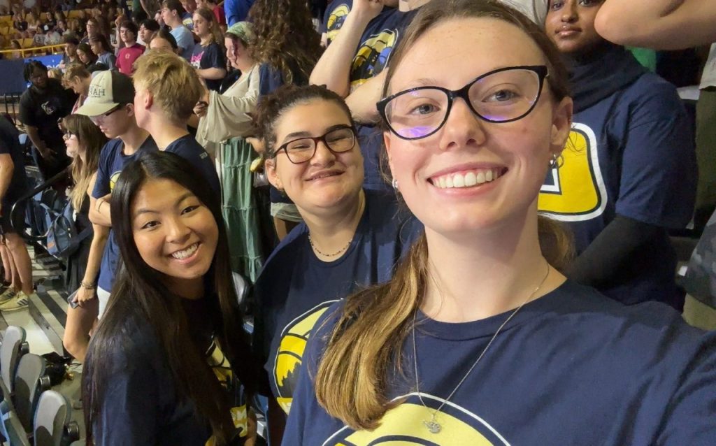 Maia Pentecost and friends take a selfie inside McKenzie Arena.