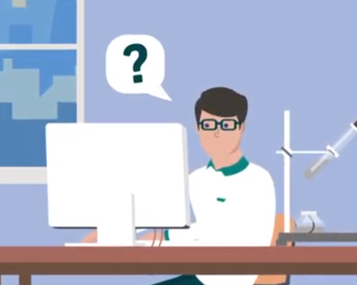 person with question bubble thinking at desk