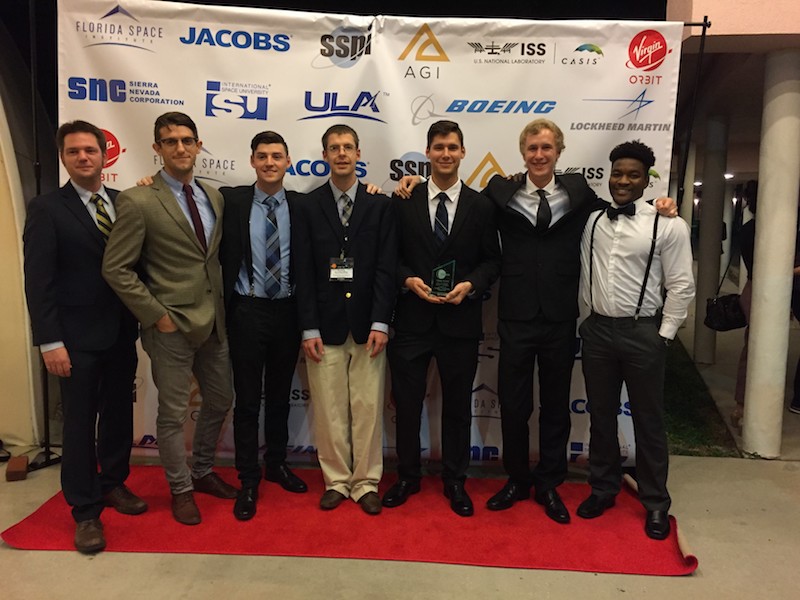 Students Standing With Professors