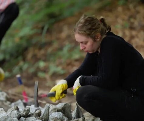 A student worker doing preservation work while abroad