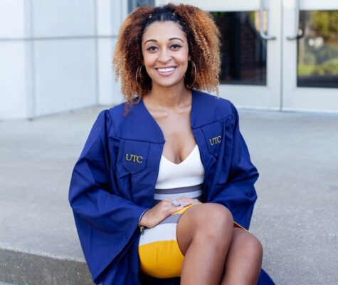 An image of a woman sitting down