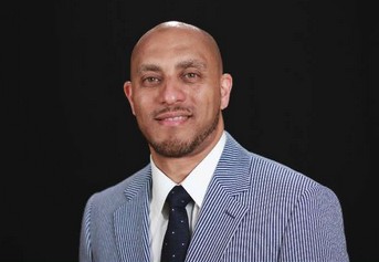 A portrait of a man in a suit