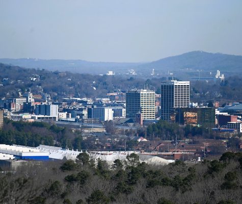 A view of the skyline of Downtown Chattanooga with mountains in the background.