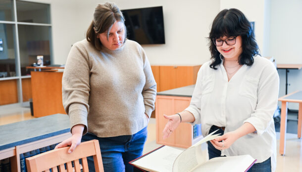 UTC Special Collections' Carolyn Runyon and Emily Ruiz show items from the Barry Moser collection