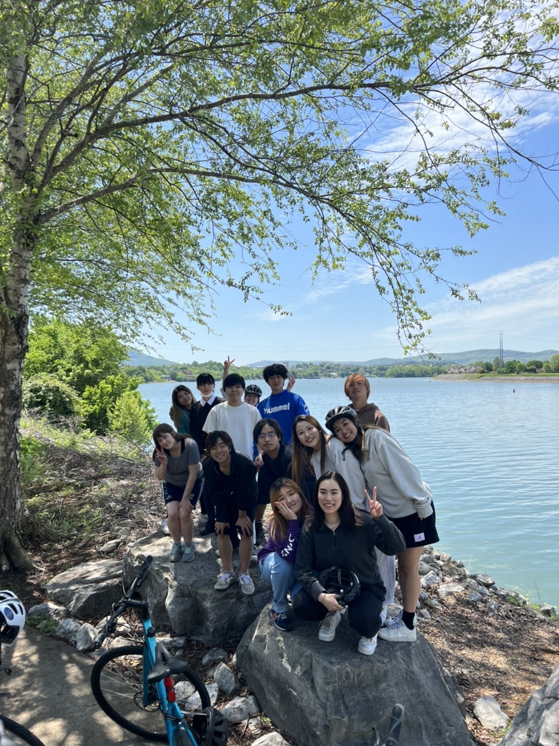 a group of international students in front of the river