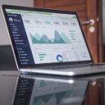 laptop showing spreadsheet of financial data