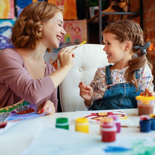 mom and daughter painting together