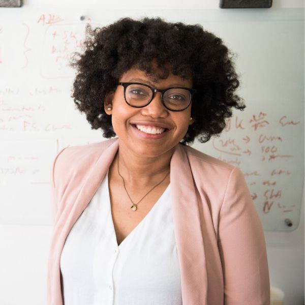 African-American female teacher at a whiteboard