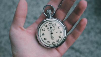 hand holding a stopwatch