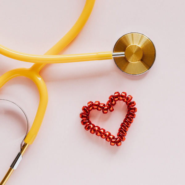yellow stethoscope with heart beside it