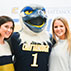 Photo of students posing with Scrappy