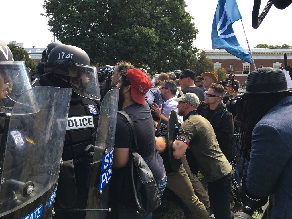 Image of white supremacists clashing with riot police during the "Unite the Right" rally in Charlottesville, Virginia.