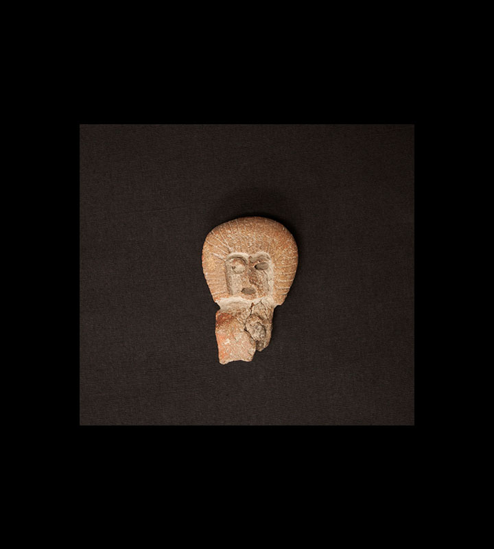 Pre-Columbian ceramic figure depicting the head and partial torso of a female, indicated by a breast. Courtesy of the University of Tennessee at Chattanooga Special Collections.