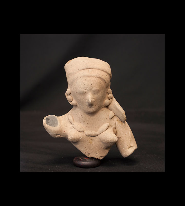 Pre-Columbian hollow ceramic bust of a woman with minimal facial features. Courtesy of the University of Tennessee at Chattanooga Special Collections.