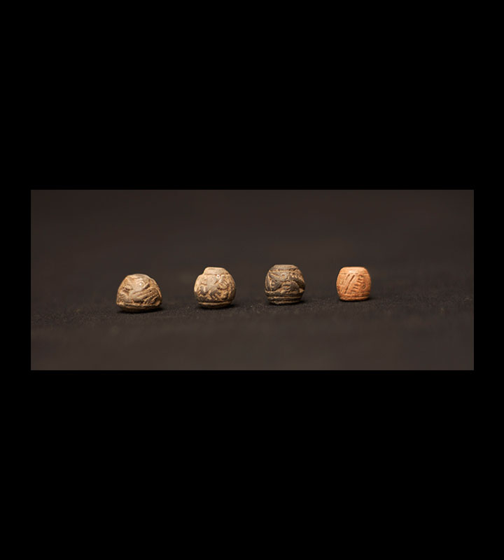 Pre-Columbian Manteno spindle whorls or beads with incised designs on them. Courtesy of the University of Tennessee at Chattanooga Special Collections.