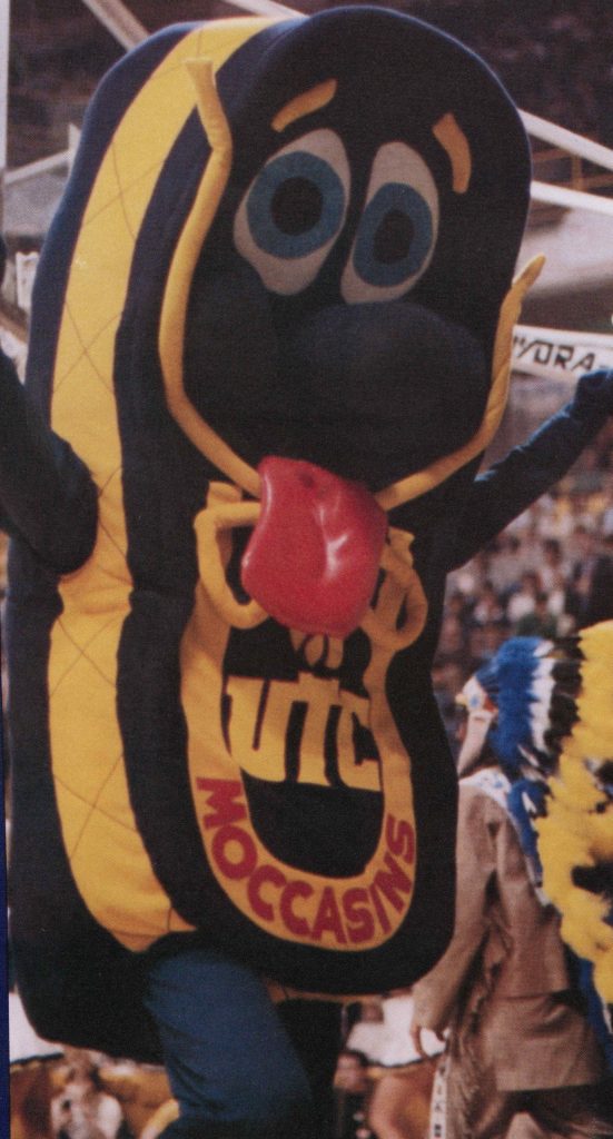 Color photograph of 1980s UTC mascot Mighty Moc, a blue and gold anthropomorphic shoe.