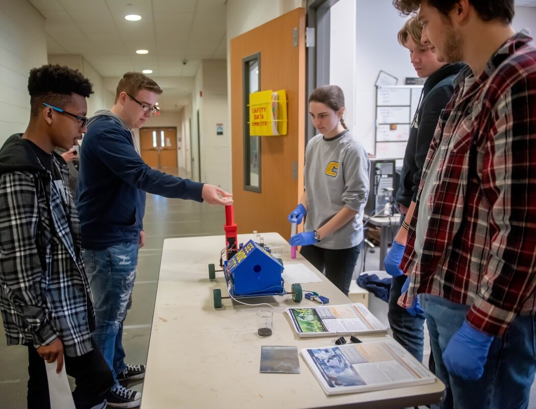 High school students at a past College Quest event getting a tour of an engineering lab